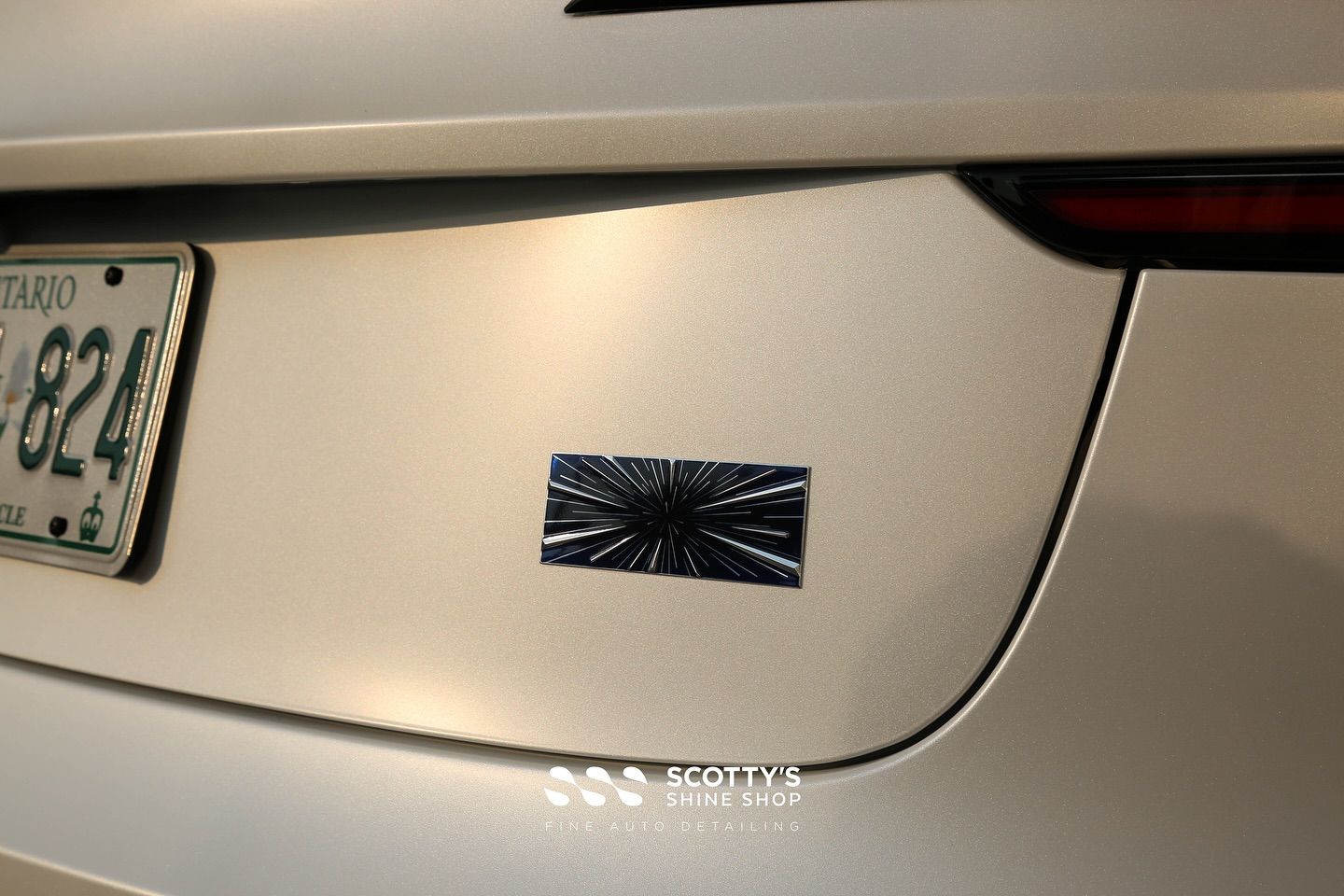 2024 Tesla Model 3 Performance Full Body Wrap in Premium Suntek Ultra Matte Paint Protection Film, Modesta BC-M Ceramic Coating and BC-06 on the Wheels rear emblem close up London, ON