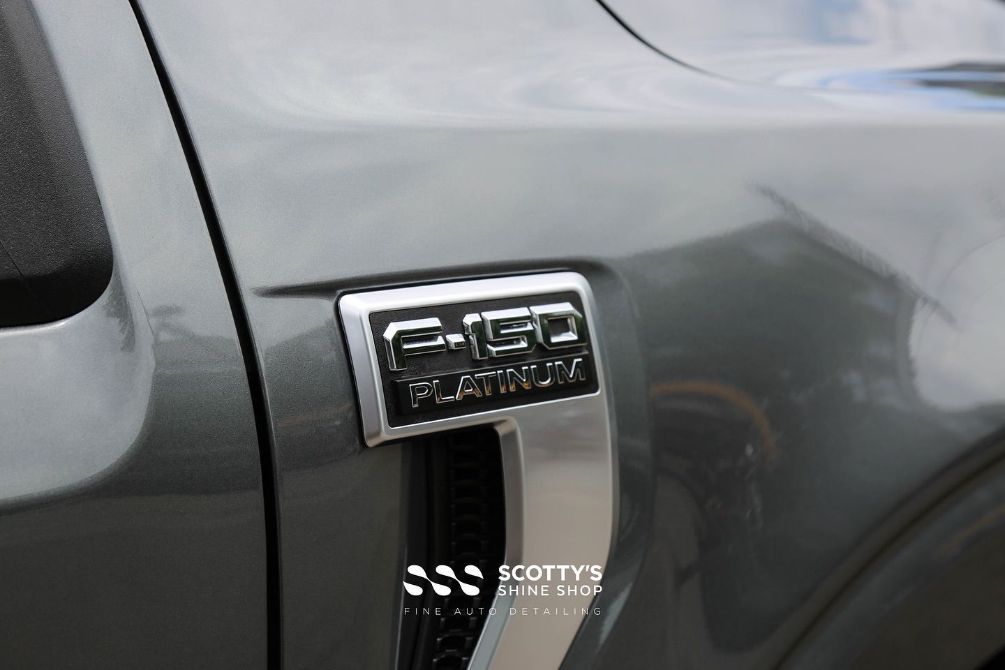 2025 Ford F-150 Platinum Llumar Formula 1 Stratos Ceramic Window Tint, Light Paint Correction, Modesta BC-X Ceramic Coating emblem close up London, Ont Canada