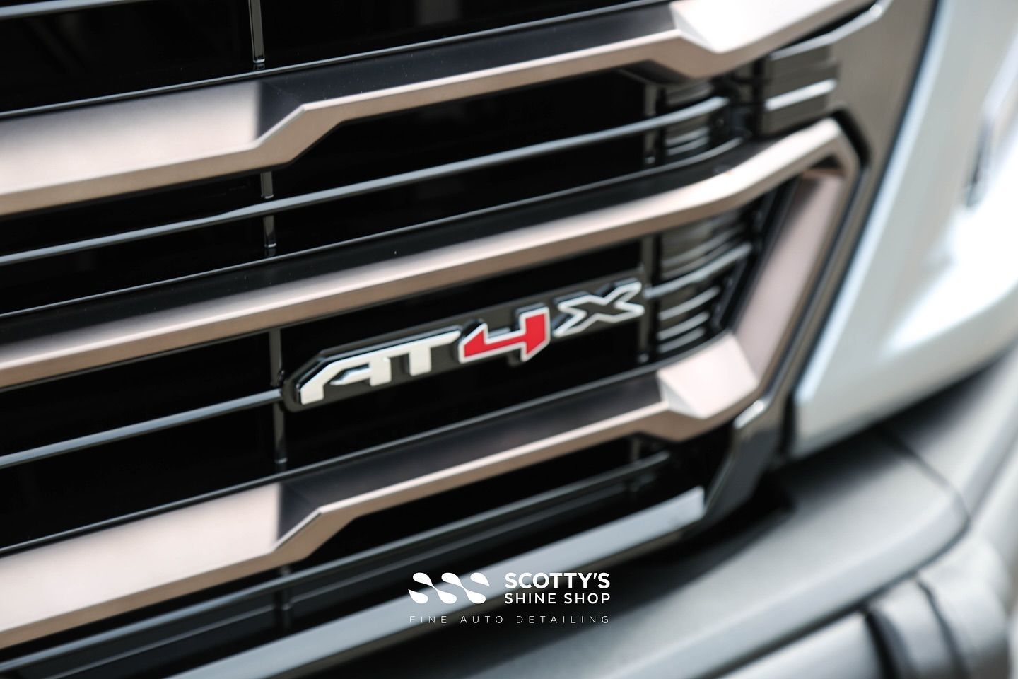 2025 GMC Sierra AT4X Full LLumar Formula 1 Stratos Window Film, Full Front-End SunTek Ultra PPF , Modesta Ceramic Coatings front grill close up London, Ontario