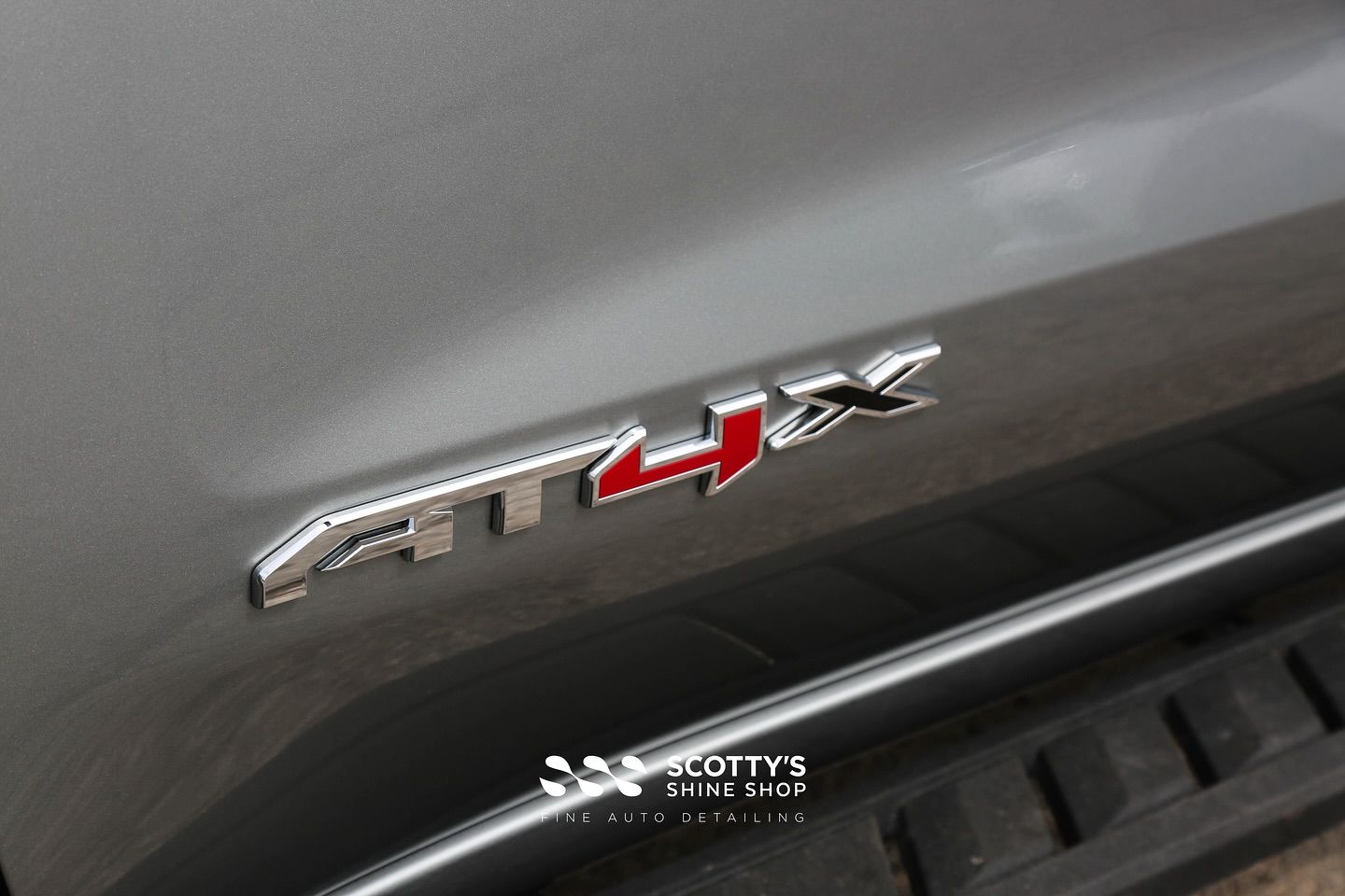 2025 GMC Sierra AT4X Full LLumar Formula 1 Stratos Window Film, Full Front-End SunTek Ultra PPF , Modesta Ceramic Coatings emblem up close London, ON