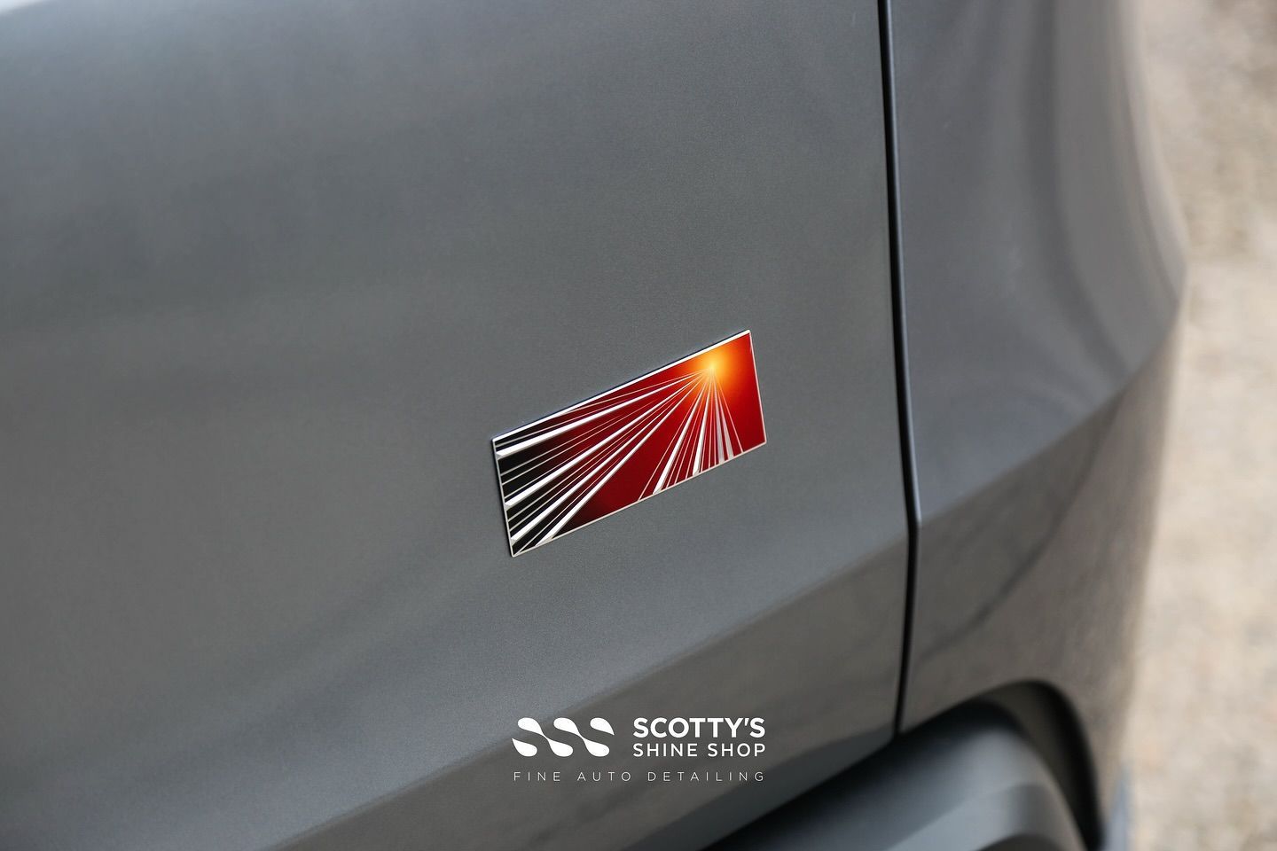 2025 Tesla Model Y SunTek Ultra Paint Protection Film, LLumar Formula 1 Stratos Ceramic Window Tint, Modesta BC-X Ceramic Coating emblem close up London, Canada