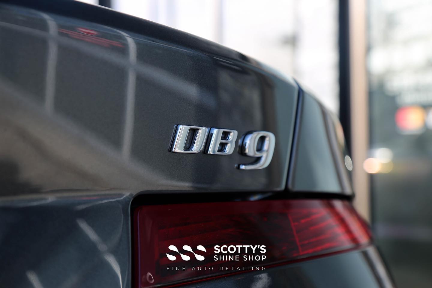 Aston Martin DB9 Xpel Prime XR Ceramic Window Tint rear emblem close up London, Ontario