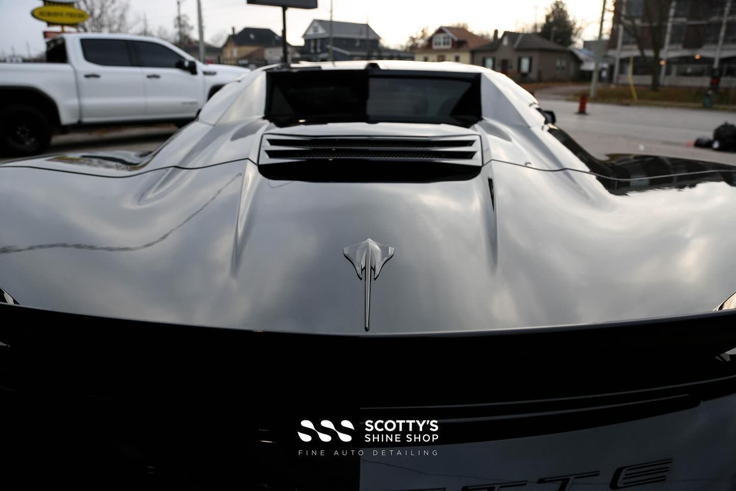 Chevrolet Corvette C8 Xpel Paint Protection Film, Paint Correction, Xpel Prime XR Plus Window Tint and Xpel Fusion Ceramic Coatings on the Wheels, Body and Glass rear emblem close up London, ON