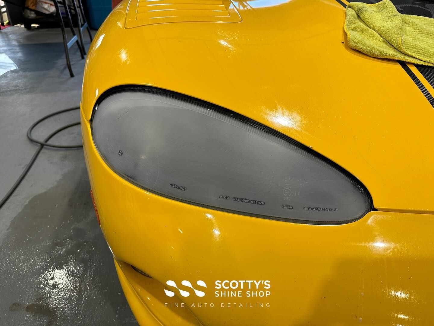 Dodge Viper Xpel Ultimate Plus Paint Protection Film on the Headlight Lenses in progress London, Ontario Canada