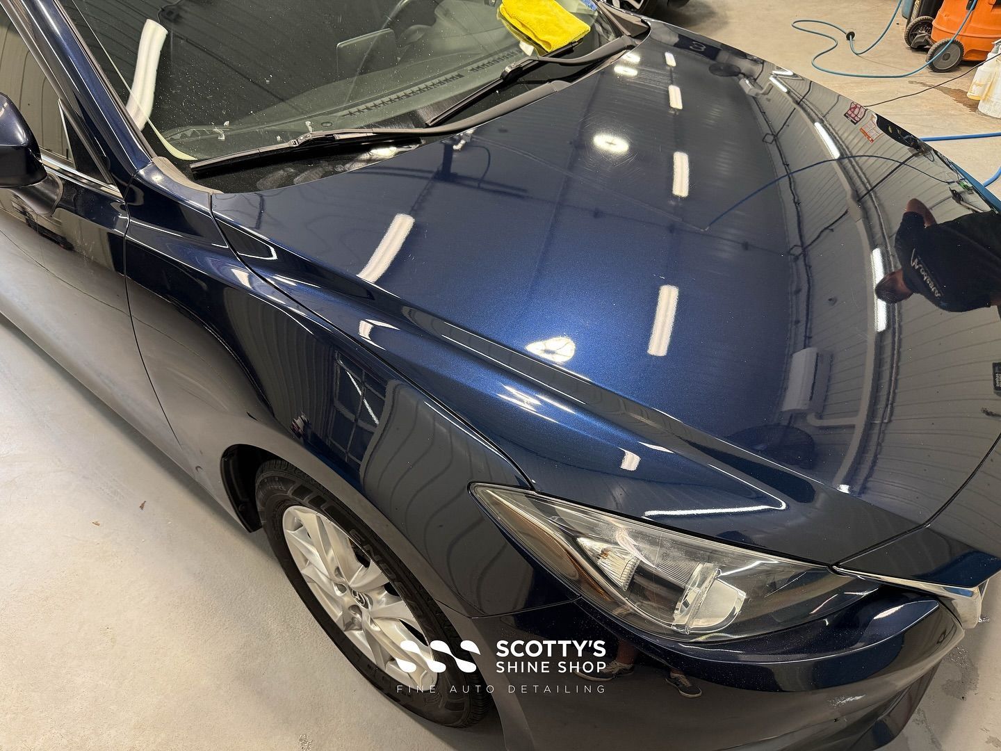 Mazda 3 Light Paint Correction, Mineral Deposit Removal Before and After front hood close up London, ON