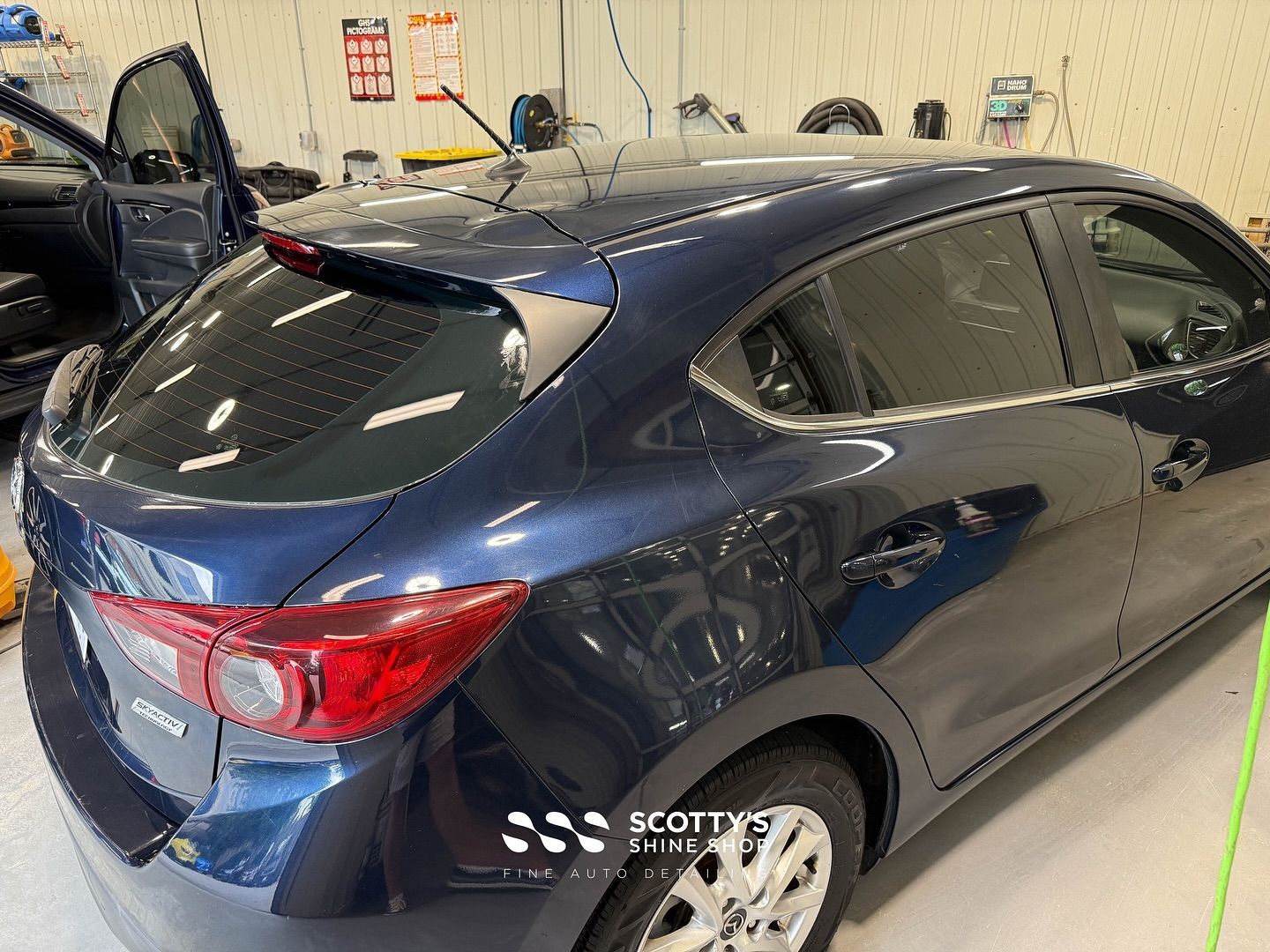 Mazda 3 Light Paint Correction, Mineral Deposit Removal Before and After rear side view after London, ON