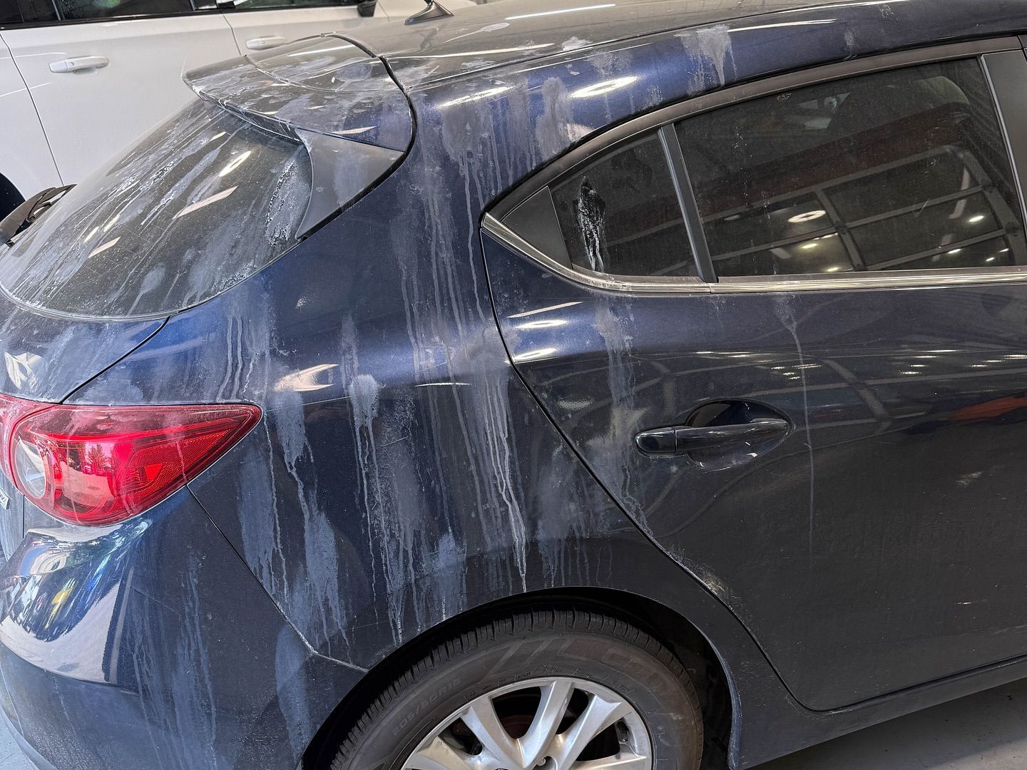Mazda 3 Light Paint Correction, Mineral Deposit Removal Before and After rear side view London, ON