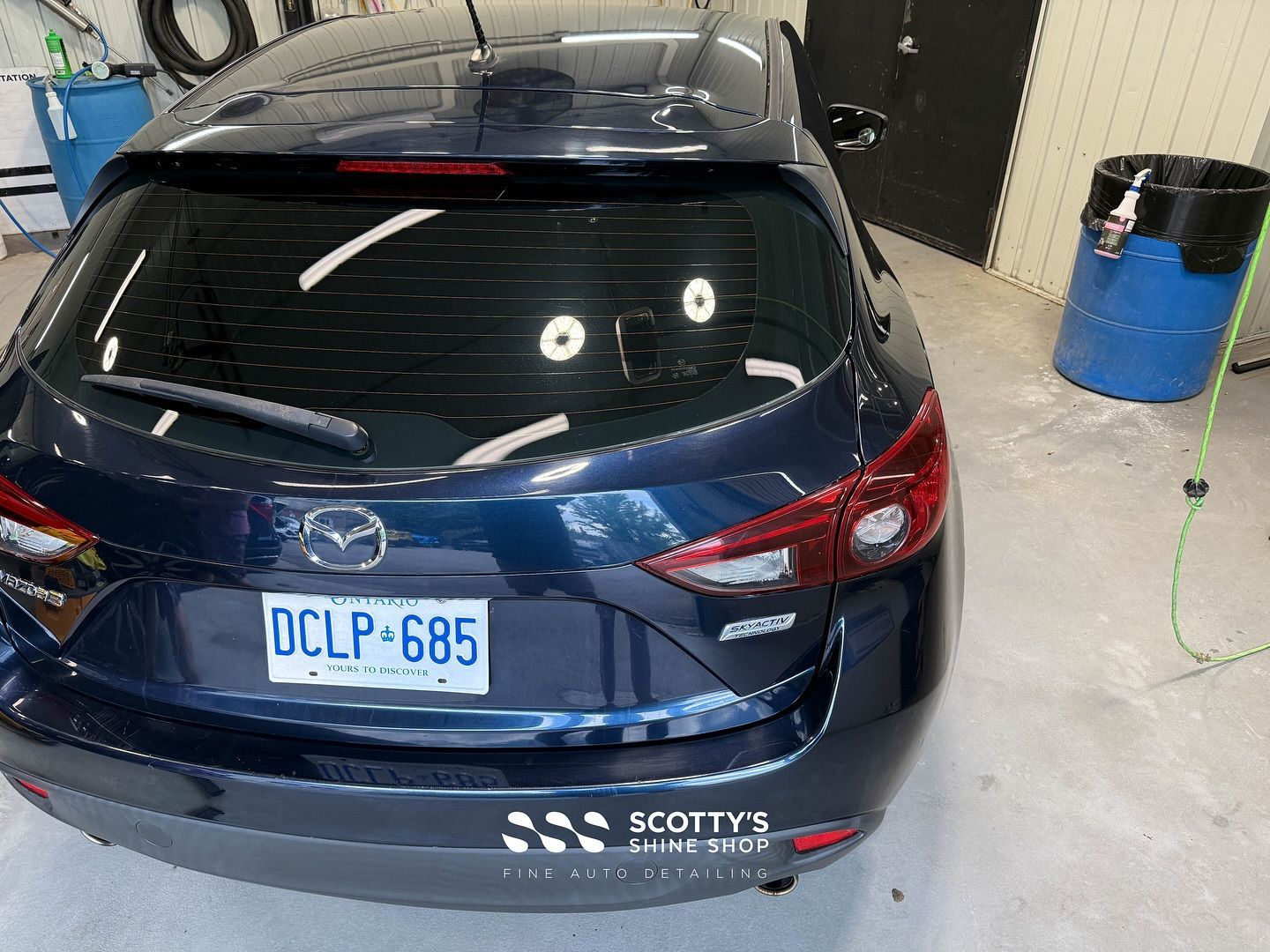 Mazda 3 Light Paint Correction, Mineral Deposit Removal Before and After rear view London, ON