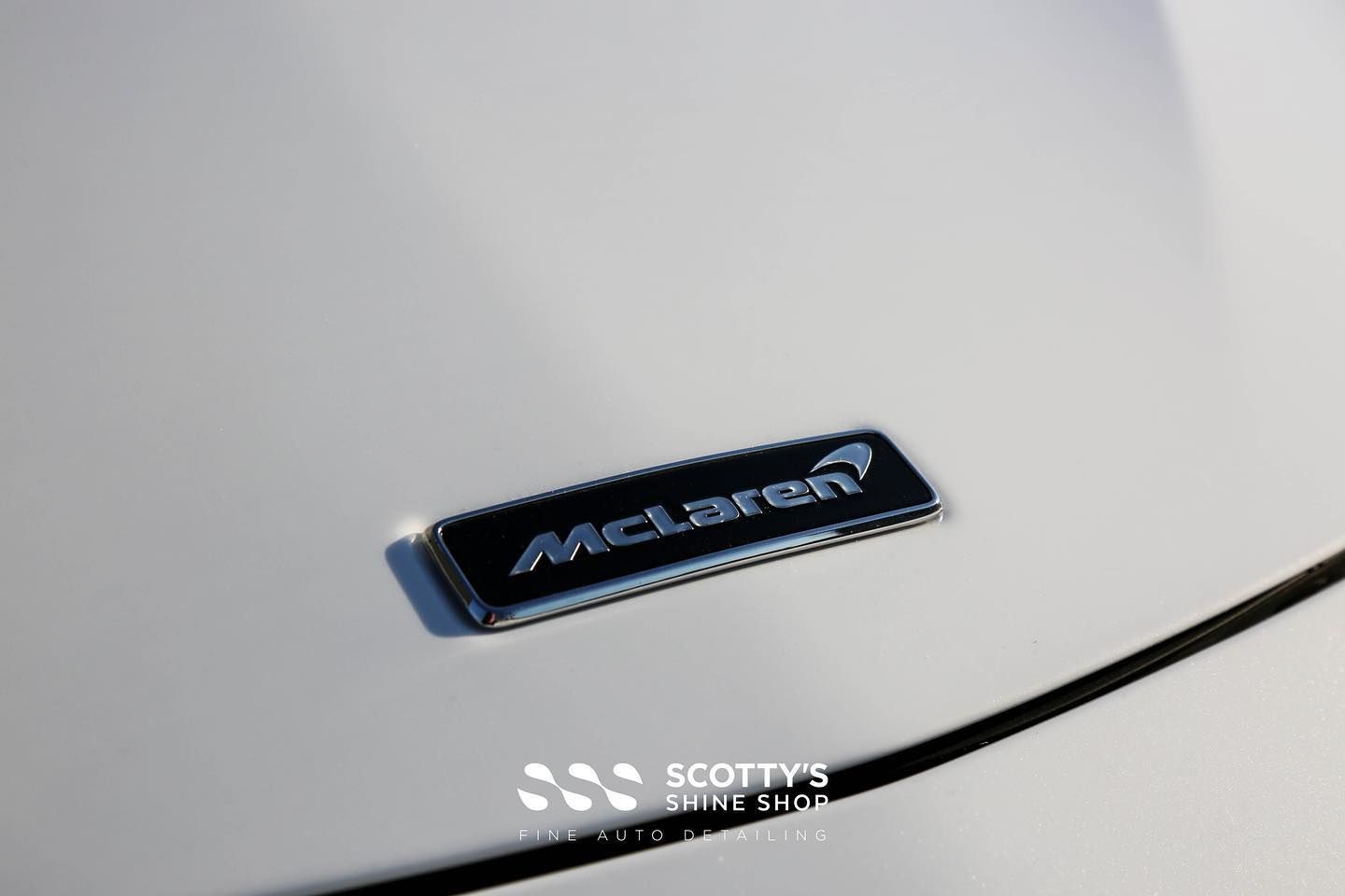 McLaren 570S Xpel Ultimate Plus Paint Protection Film and a Premium Ceramic Coating emblem close up London, ON Canada