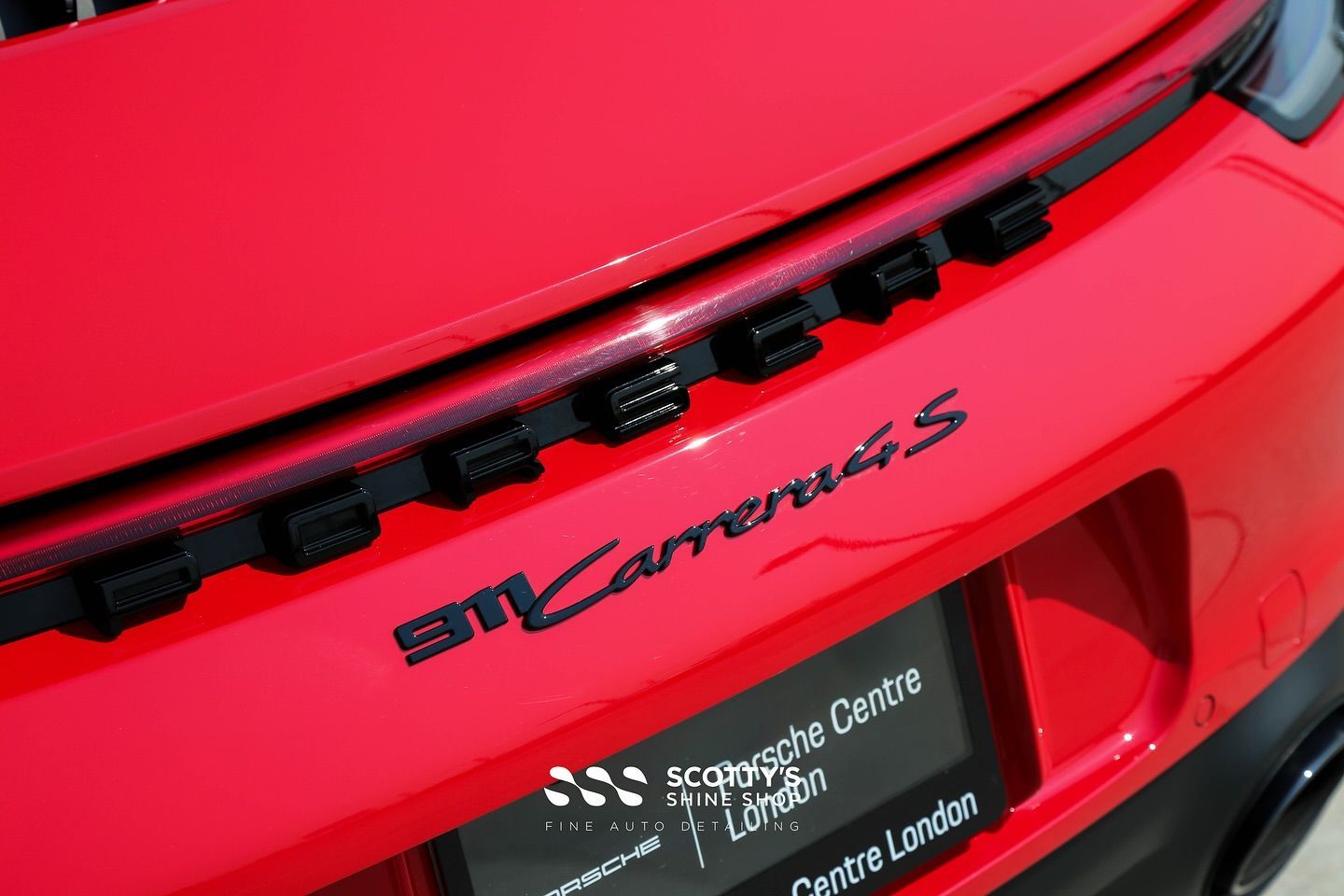 Porsche 911 Carrera 4S Premium Suntek Ultra Paint Protection Film resr emblem close up London, ON