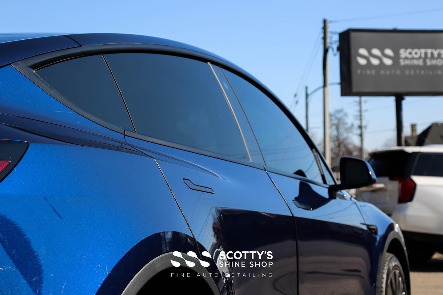 Tesla Model Y Xpel Prime XR Plus Ceramic Window Tint and Xpel Ultimate Plus Paint Protection Film side view close up  London, Ontario