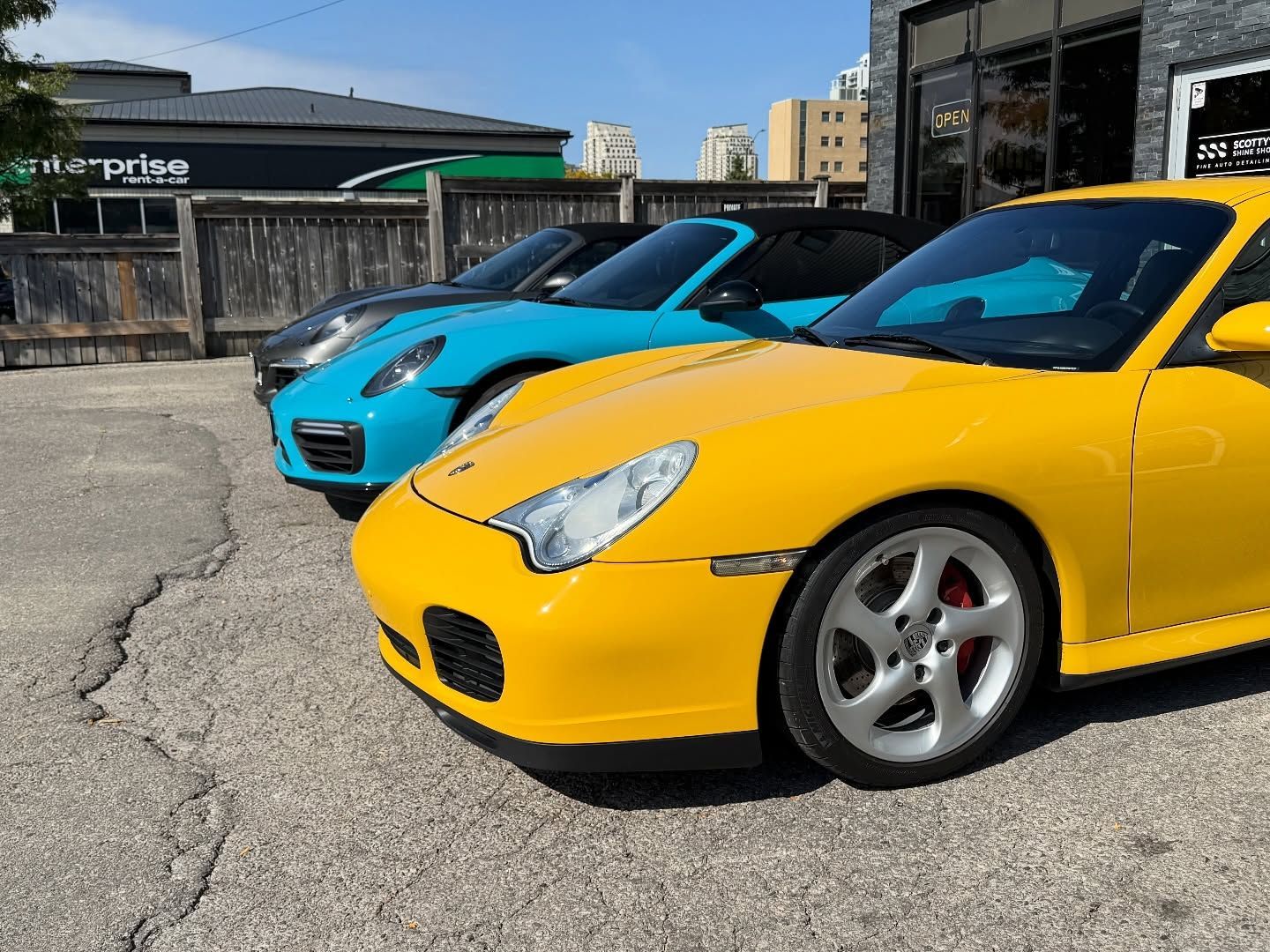 Three 911 in front of Scotty's Shine Shop Detailing and Paint Protection London