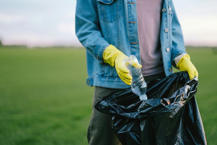 Quick clear team member collecting rubbish in black bag