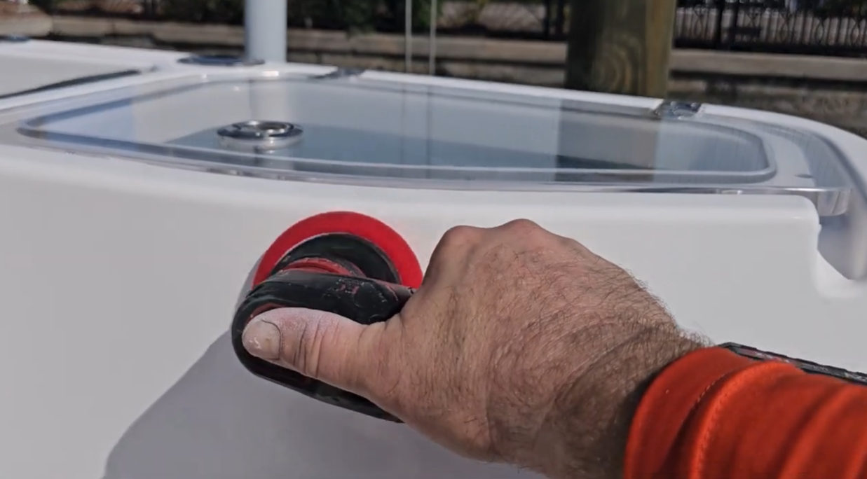 Operator with buffer polisher waxing boat.