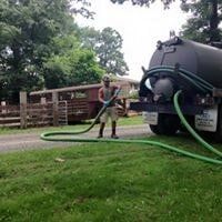Man with Septic Truck Hose — Septic Tank Contractor in Wythe County, VA