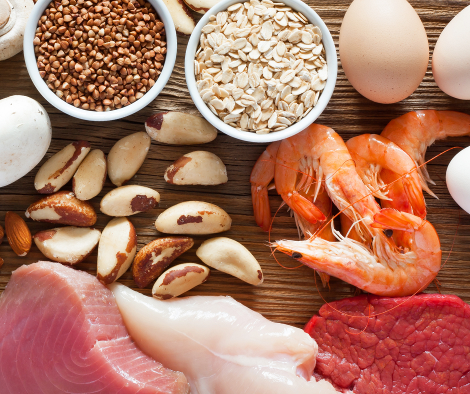 A wooden table topped with a variety of foods including meat eggs nuts and grains