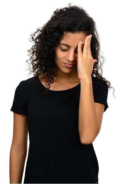 stressed woman with hand on face