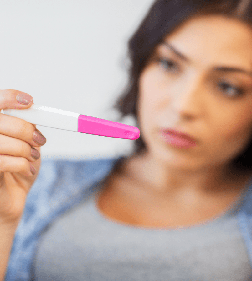 woman waiting for results of pregnancy test kit