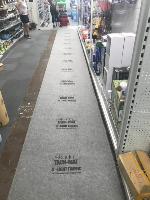Honcho Commander Mat protecting a shopping aisle in a Mitre 10 store