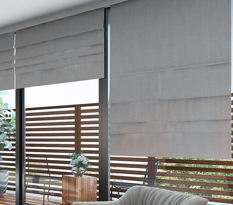 Gray and White Striped Roman Shade Partially Covering a Window on a White Wall — Instyle Curtains & Blinds in Bungalow, QLD