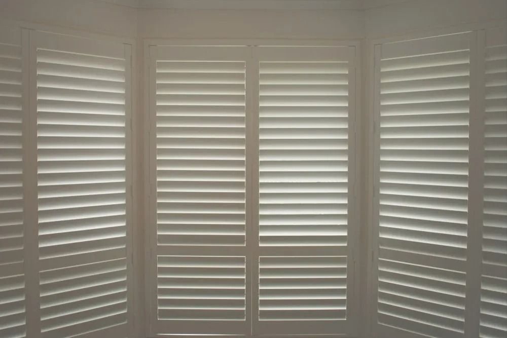 White Window Shutters, Covering a Multi-pane Window — Instyle Curtains & Blinds in Bungalow, QLD