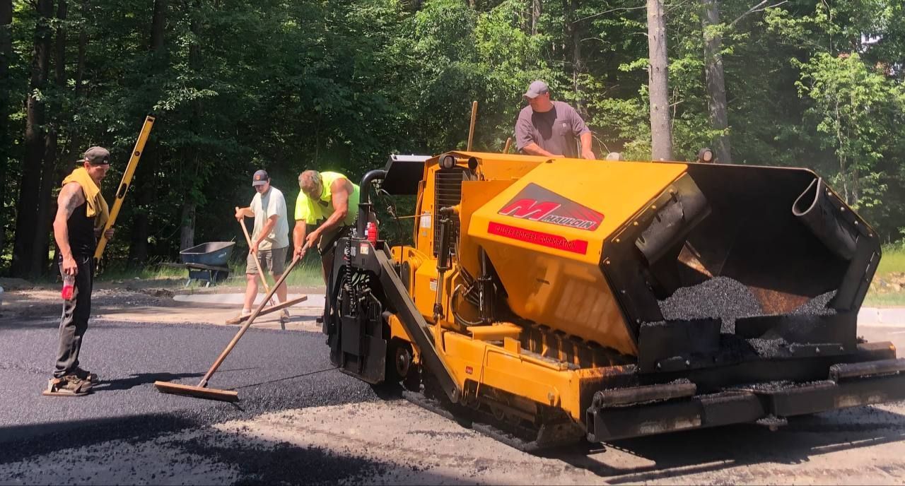 Perfectly paved roads by Dan's Paving, using a steam roller for a smooth, durable, and high-quality finish