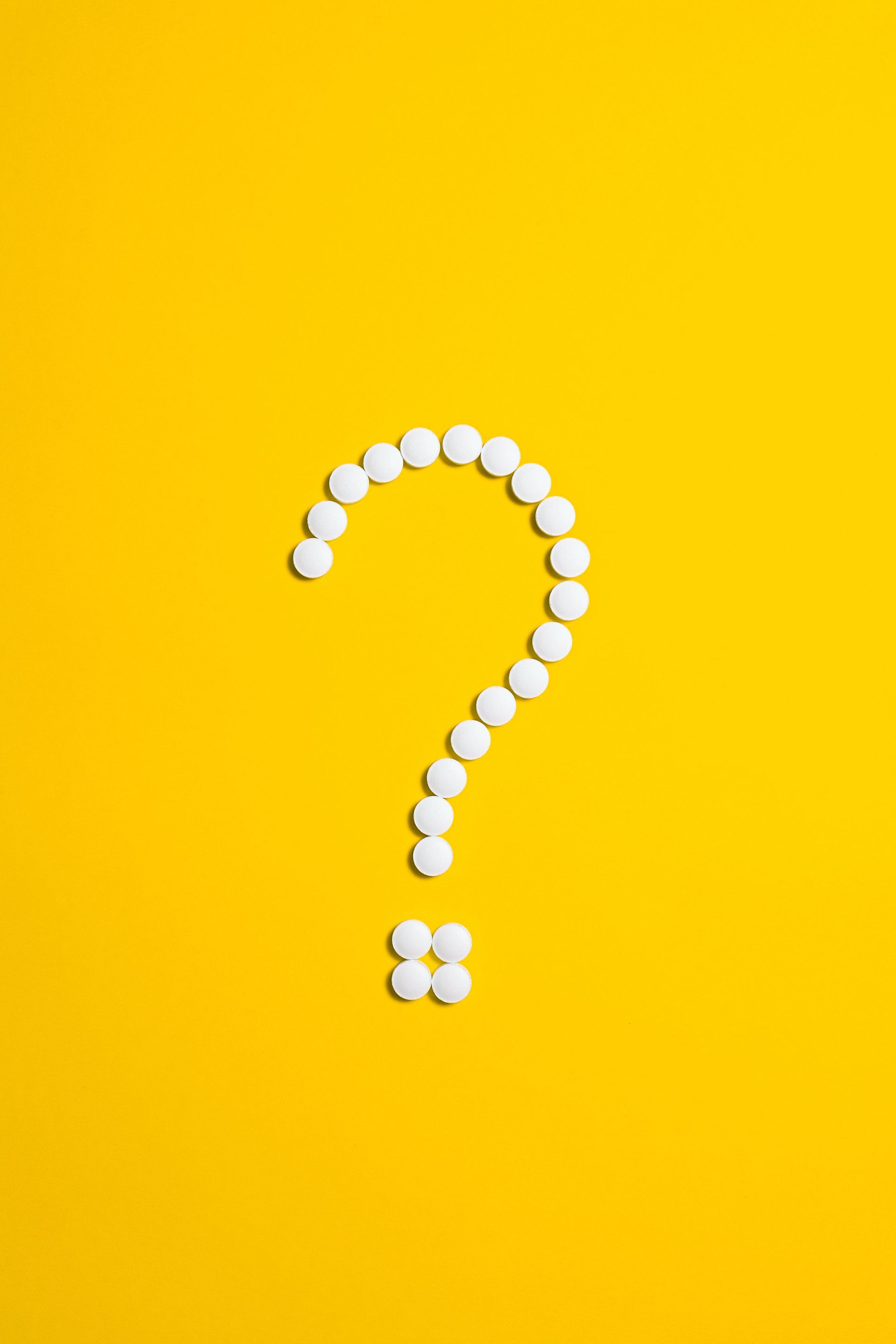 white question mark with yellow background 
