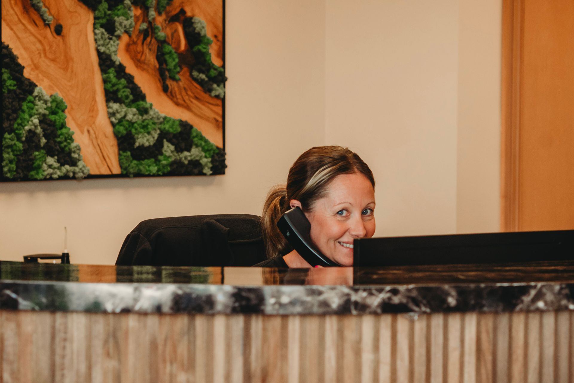 A group of women are sitting on a couch holding baskets.