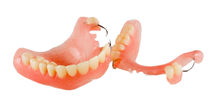 A pair of dentures with a broken tooth on a white background.