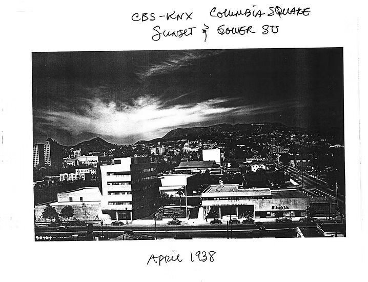 Black-and-white city skyline under dramatic clouds, captioned “April 1938.”