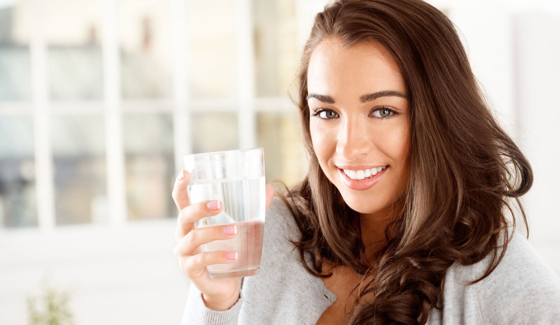 Running Water — Smiling Woman Holding a Glass of Water in Damascus, OR
