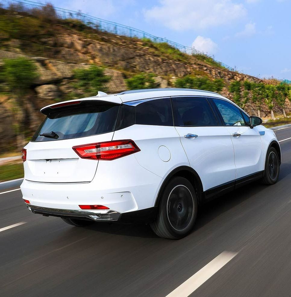 A White SUV is Driving Down a Road — Territory Limousine Service in Marrara, NT