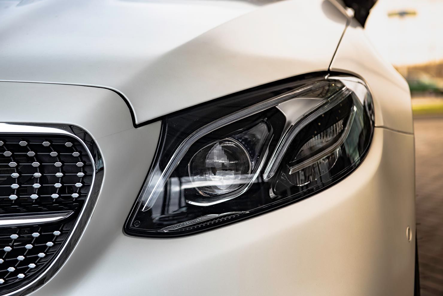 A Close Up of a White Car's Headlight — Territory Limousine Service in Marrara, NT