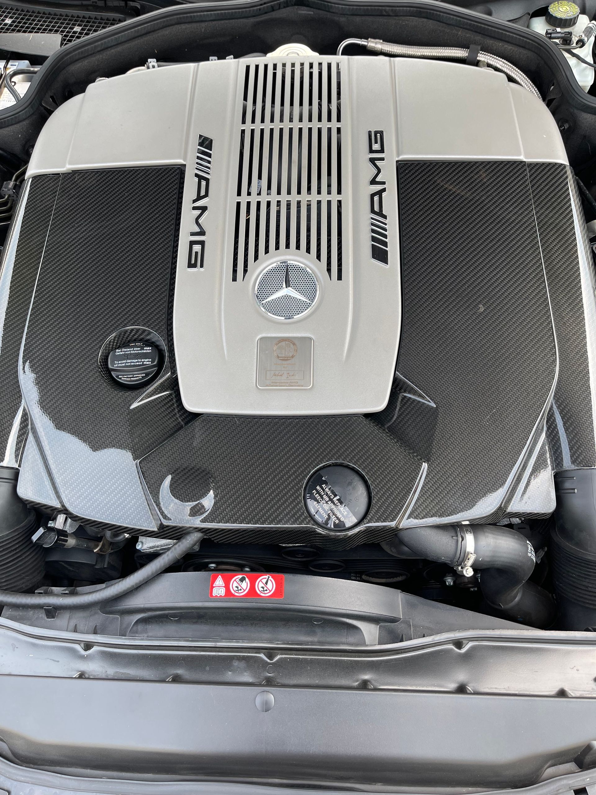 Mercedes-AMG engine with a silver and black cover, displaying 