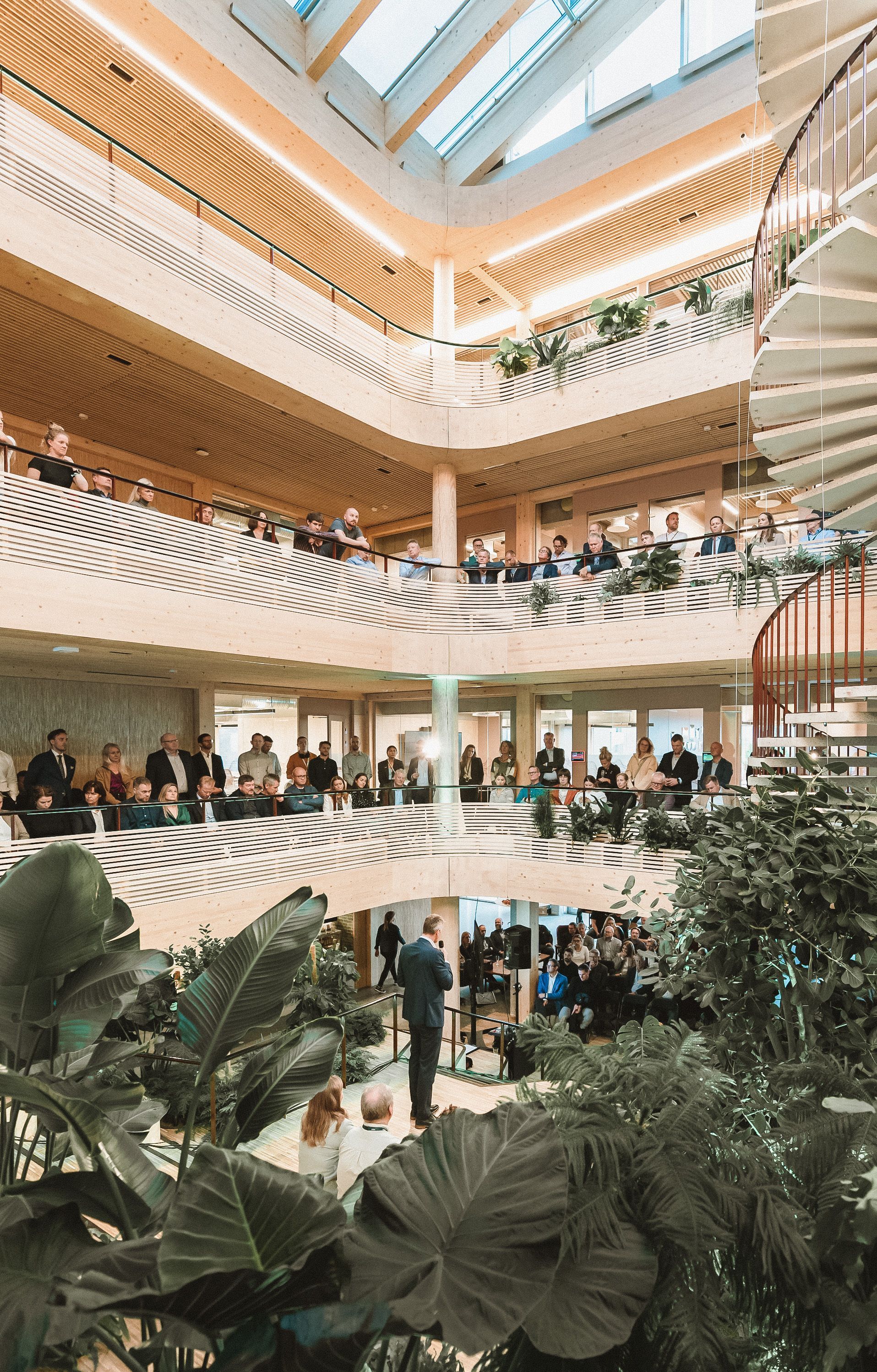 Blue ferry at a dock, people boarding. Harbor with cranes and overcast sky.