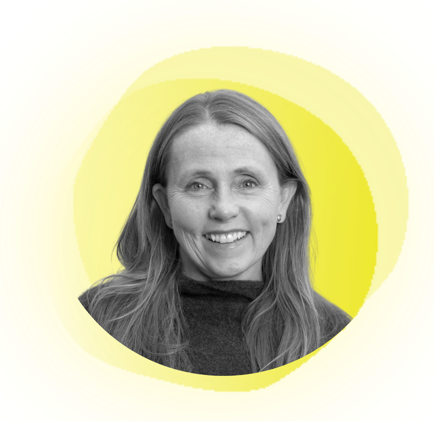 Woman with blonde hair pulled back, smiling, wearing a dark jacket, set against a peach background.