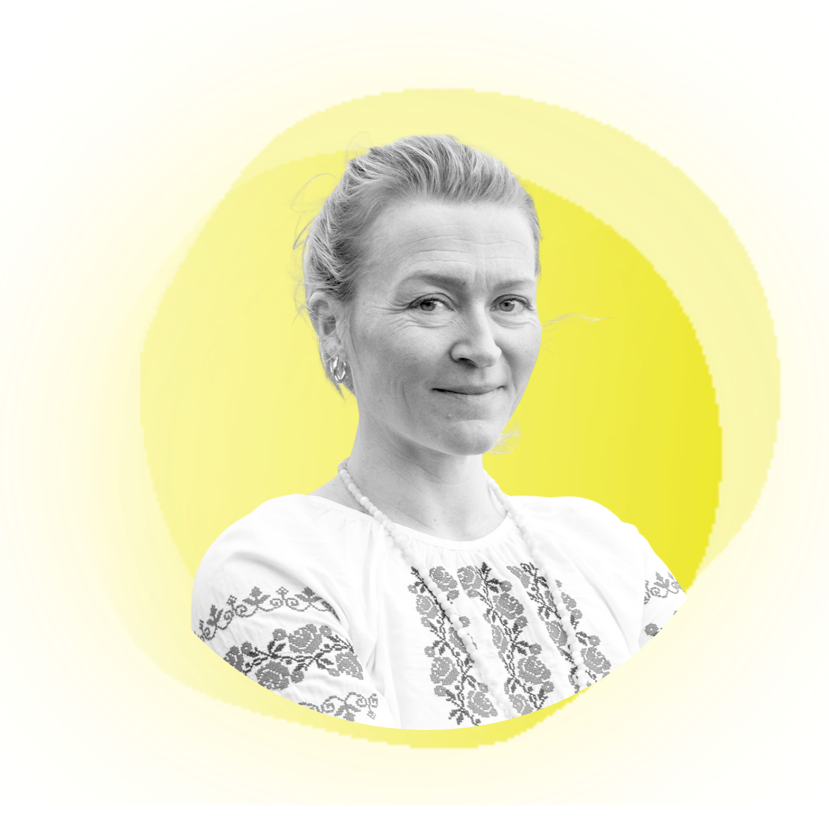 Woman with blonde hair pulled back, smiling, wearing a dark jacket, set against a peach background.