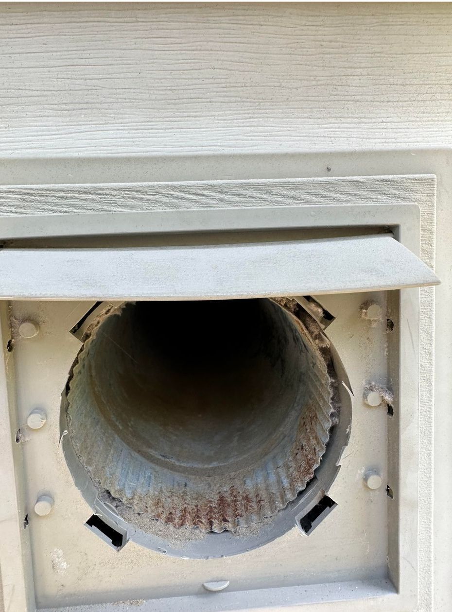 A close up of a pipe with the lid open on a wall.