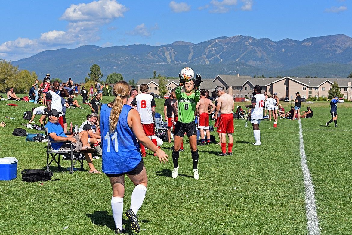 Players warming up before a match at the Whitefish Summer Games, preparing for a day of competitive soccer and community fun.