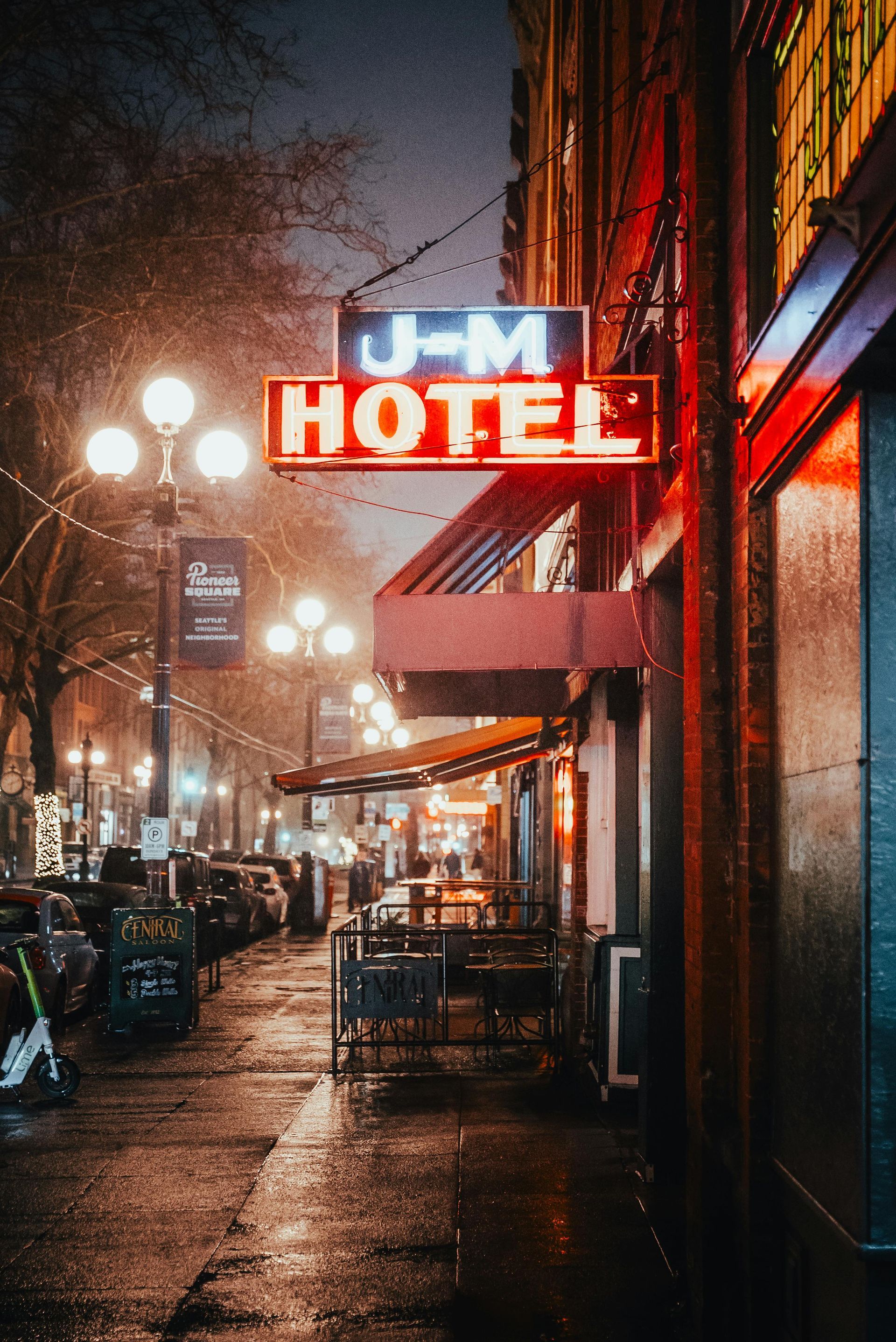 The j-m hotel is lit up at night