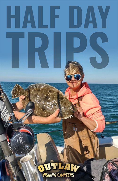A woman is holding a fish in her hands on a boat.