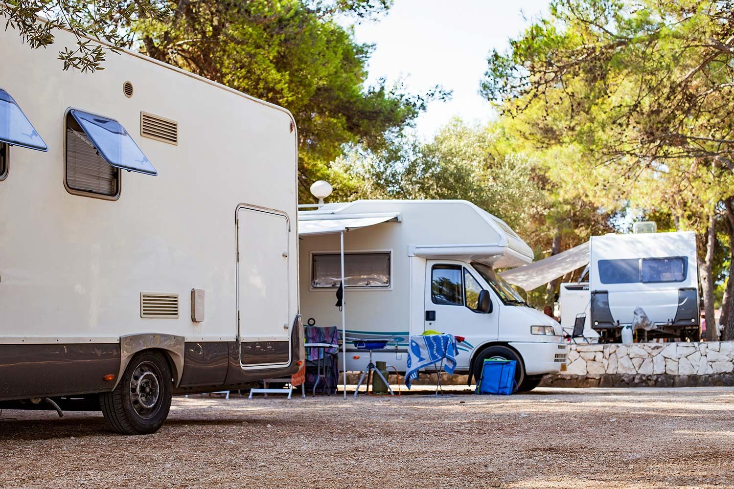 Couple of RVs Parked in a Campground Couple of RVs Parked in a Campground
