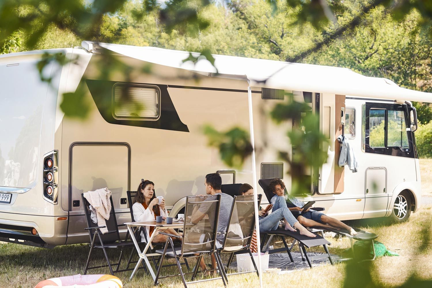A Group of People are Sitting Outside of the RV