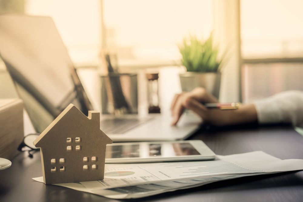 A Wooden House Model on a Desk — Tenth Avenue Accountants & Financial Advisors in Toukley, NSW