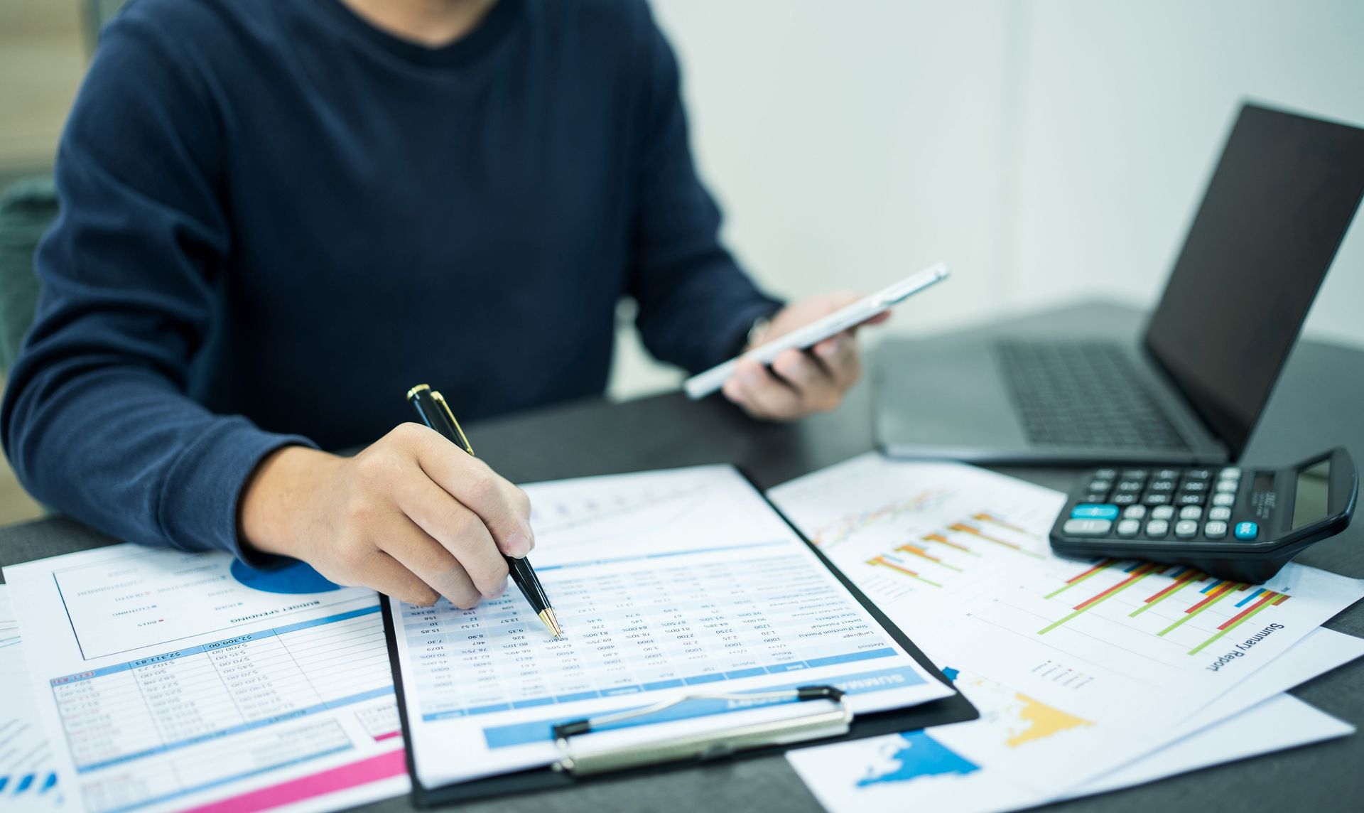 A Person Reviewing Financial Documents — Tenth Avenue Accountants & Financial Advisors in Toukley, NSW