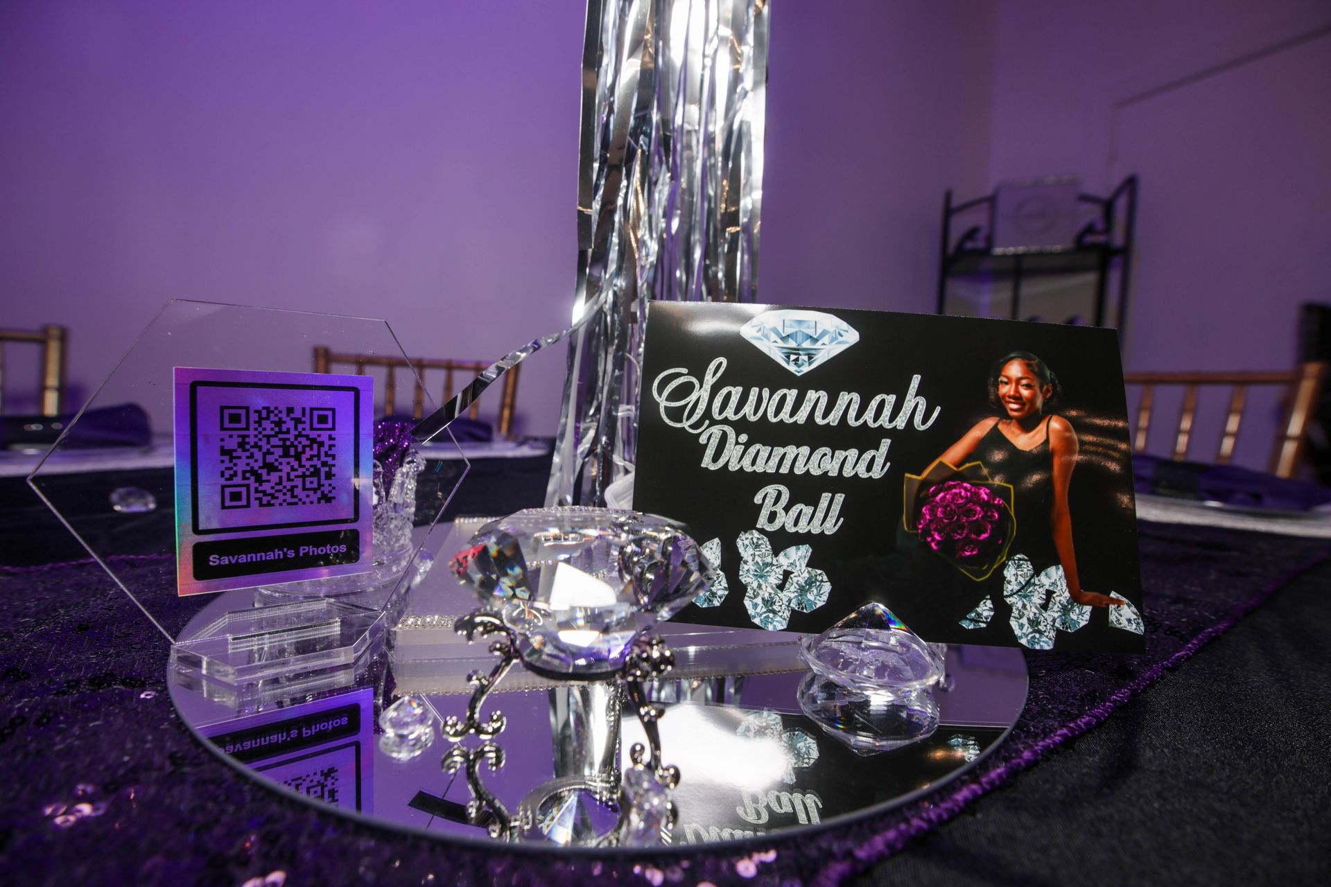 Three green heart shaped balloons are sitting on a table