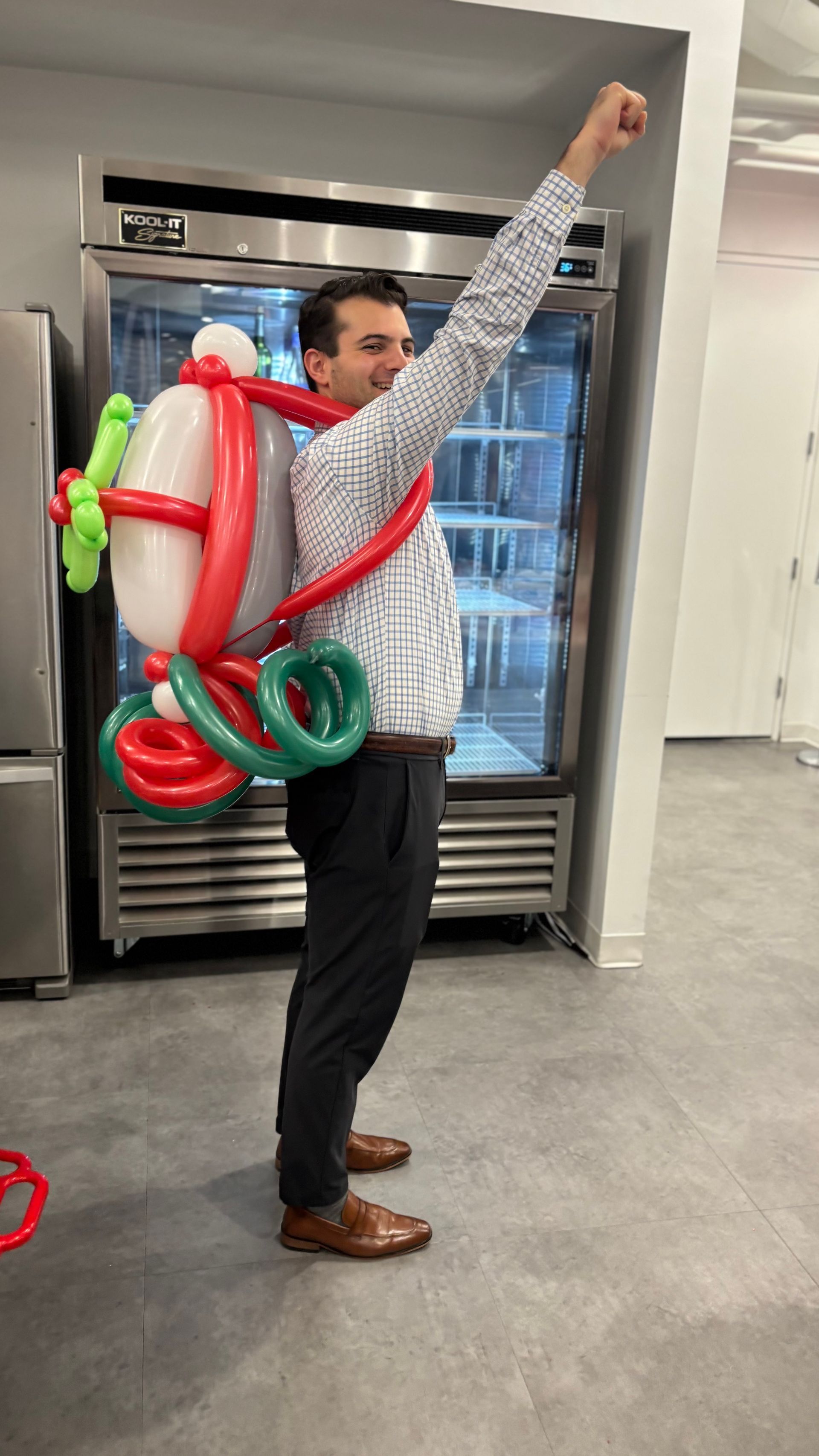 Man wearing a Christmas themed balloon Jet pack