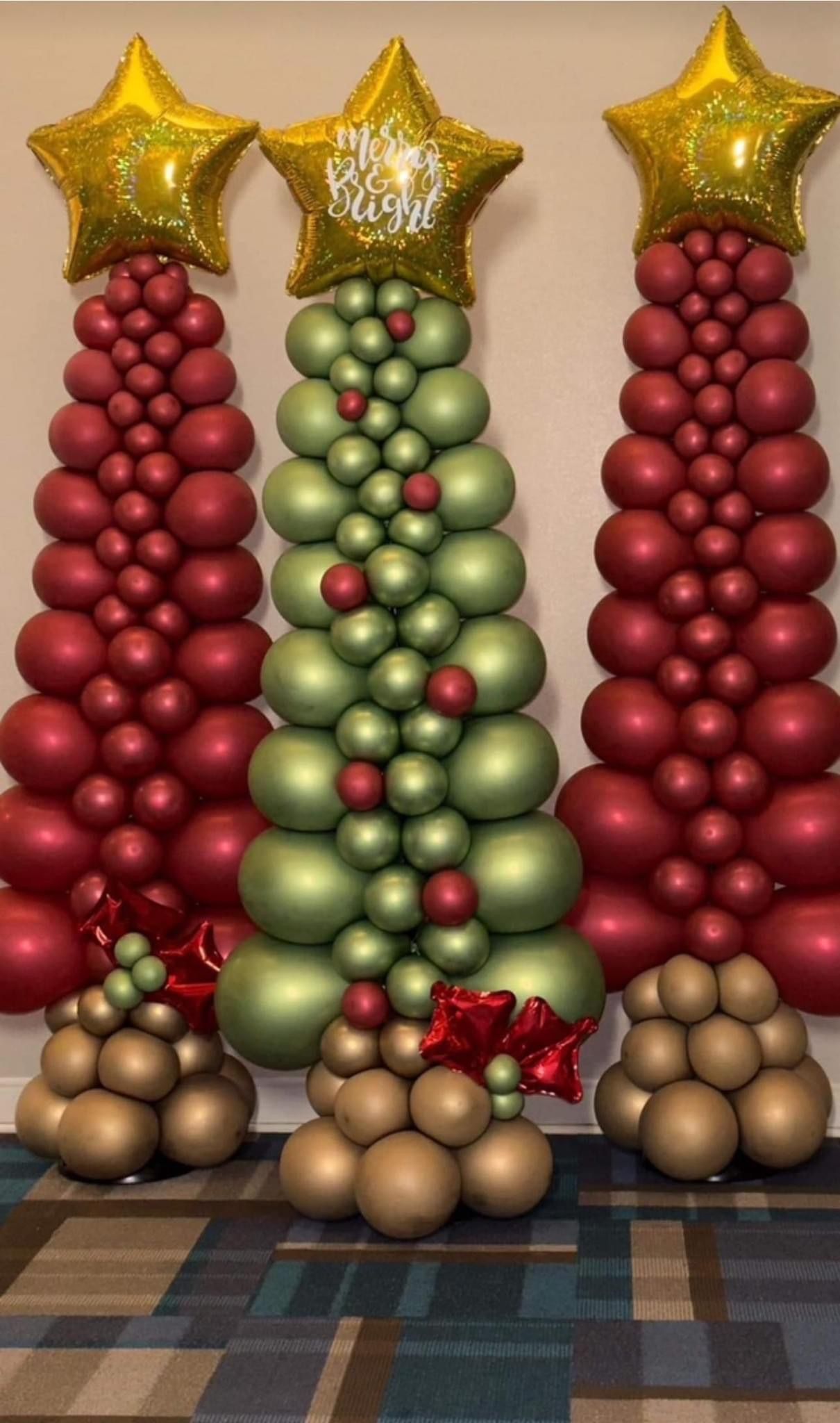 Three balloon Christmas trees: two red, one green. Gold star toppers and bases.