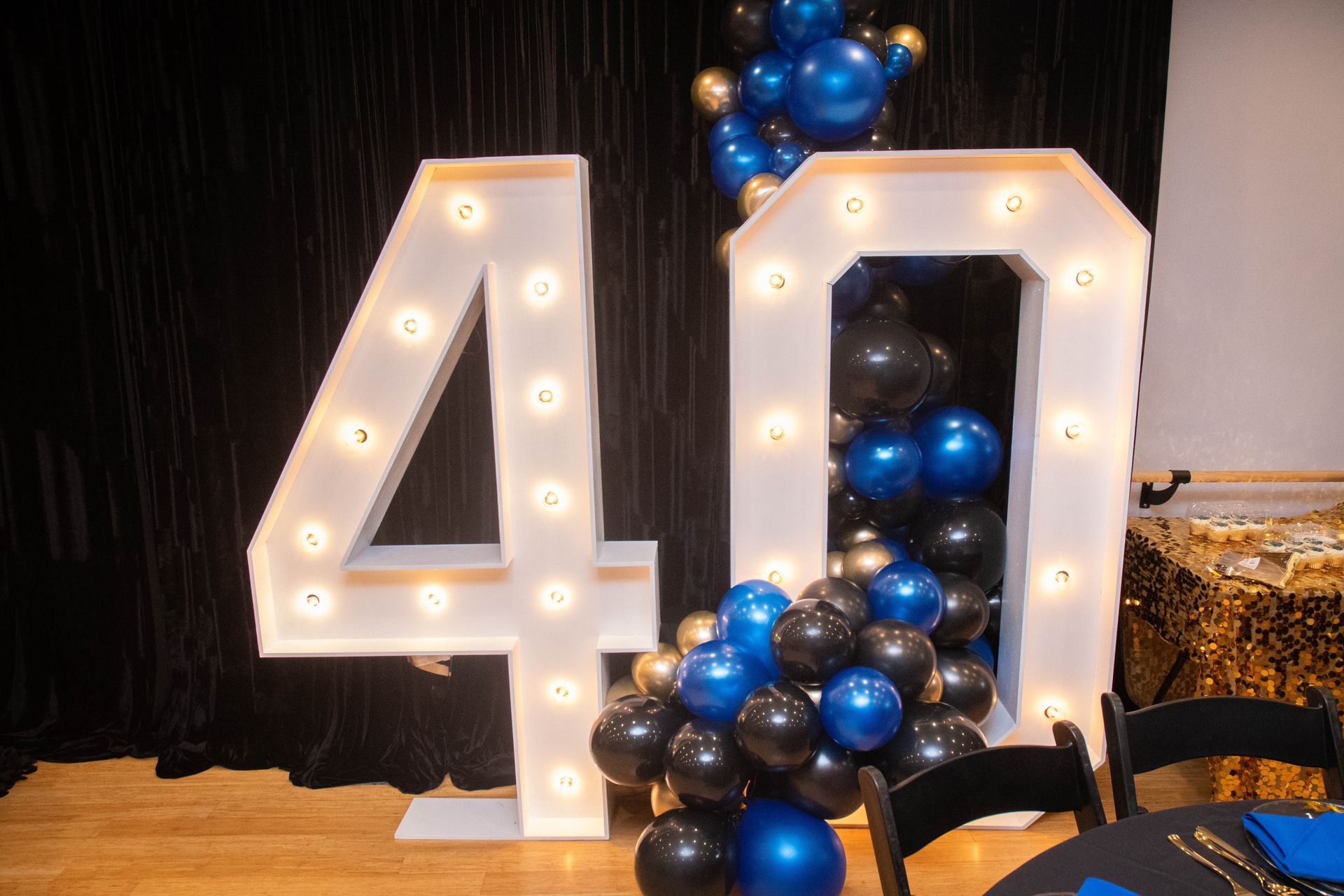 A room filled with balloons and decorations for a baby shark birthday party.