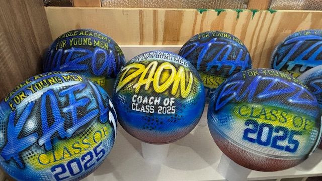 Basketballs with custom airbrush designs;
